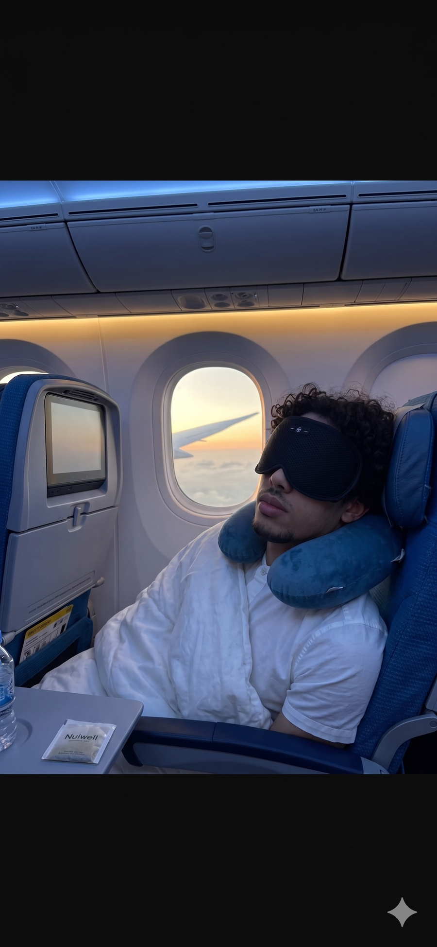 Homme qui porte un masque de sommeil dans un avion